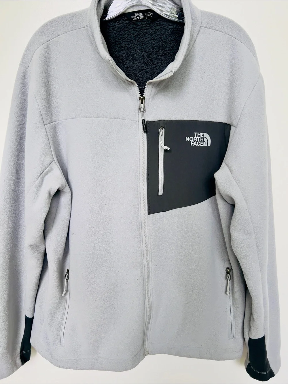 The North Face Men’s Light Gray Fleece Jacket with Black Chest Panel